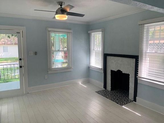 entry view & fireplace in living room