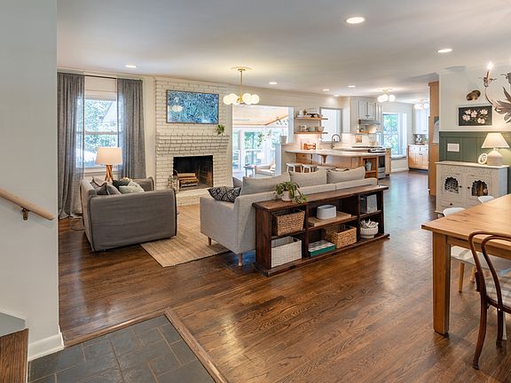 Upon entering the home, you are greeted with a beautiful open floor plan complete with living, dining, and kitchen.