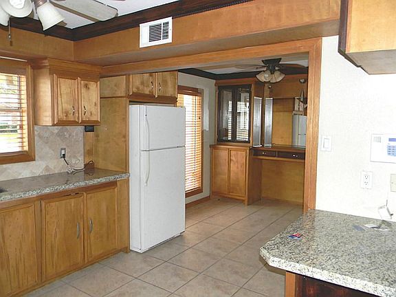 Open to the dining as well as the den, this home is very open with lots of natural light