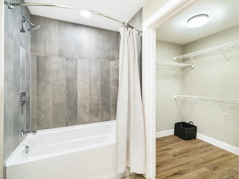 A clean, well-designed bathroom at Modera McGavock, featuring modern finishes and generous storage, conveniently located near Nashville's dining and music scene.