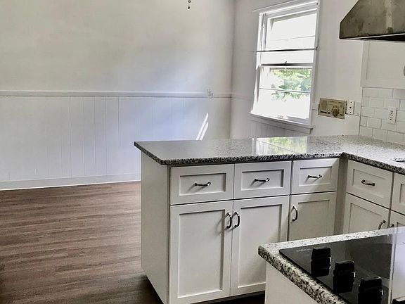 Kitchen and eating area with ceiling fan