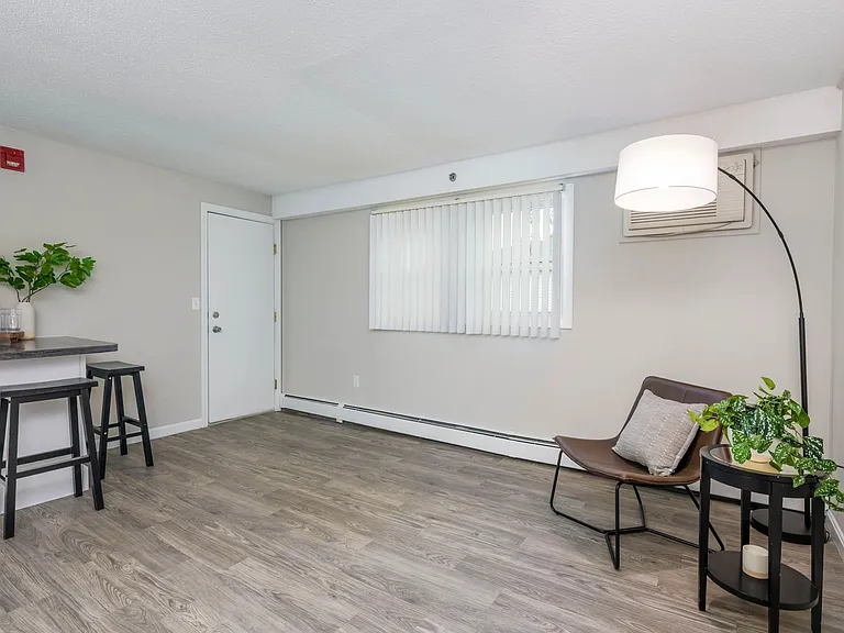 Your spacious living room features large windows allowing natural sunlight to shine through.