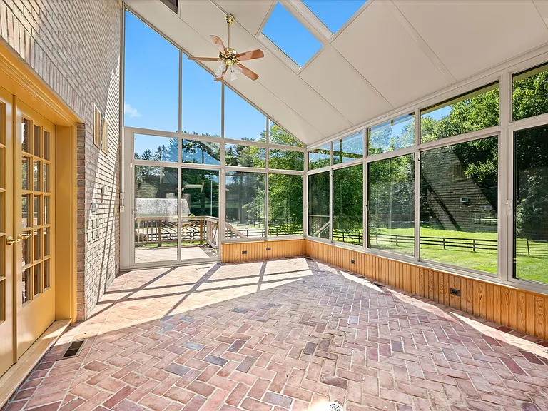 Stunning, light-flooded sunroom with lovely views.