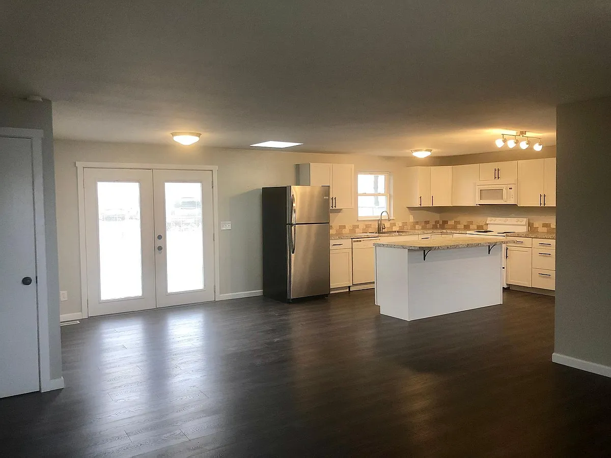Open concept living, dining and kitchen. - 1703 S Monroe St