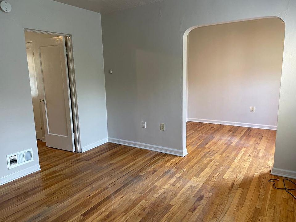 Living room. View of entrance to dining room and bedroom door