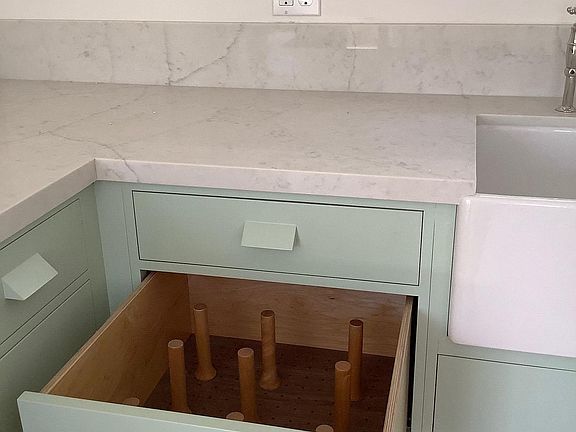 Kitchen detail of counters, as well as unique drawer storage system.