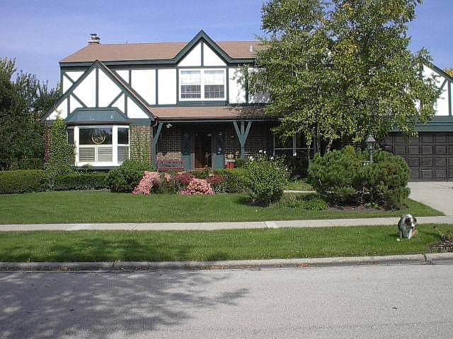 real stucco exterior and wood trim