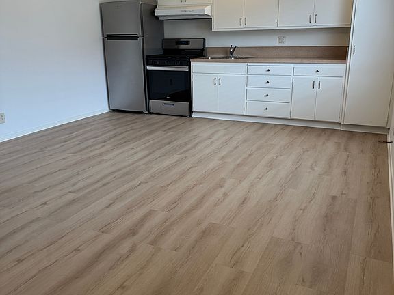 Lots of cabinet space including a broom closet