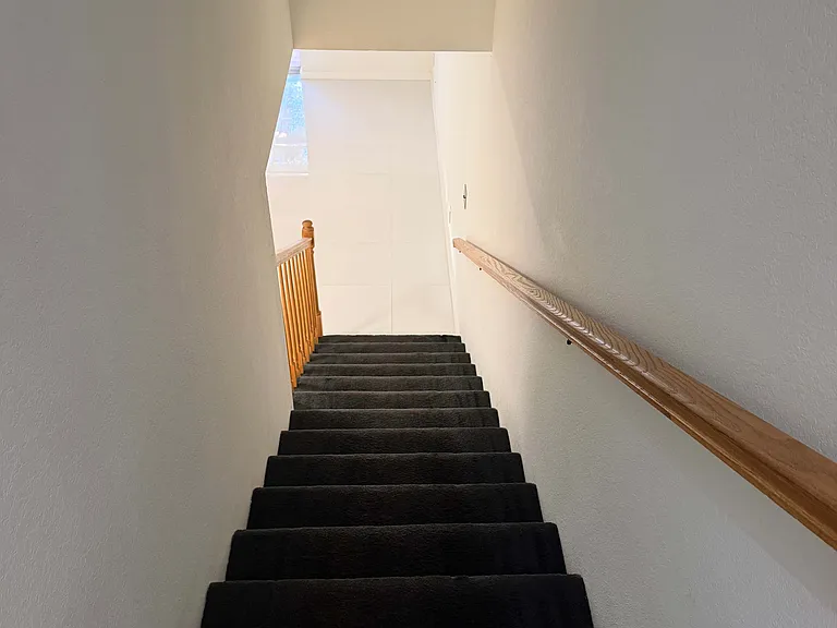 View as you enter the first floor bedroom / theater / office with ensuite bathroom from the second floor kitchen