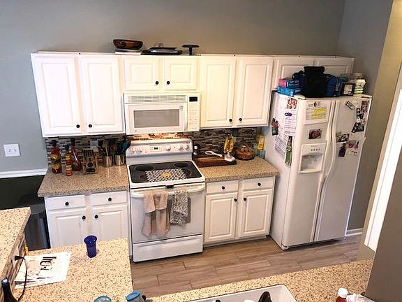 new ceramic floors in kitchen, upgraded backsplash and count