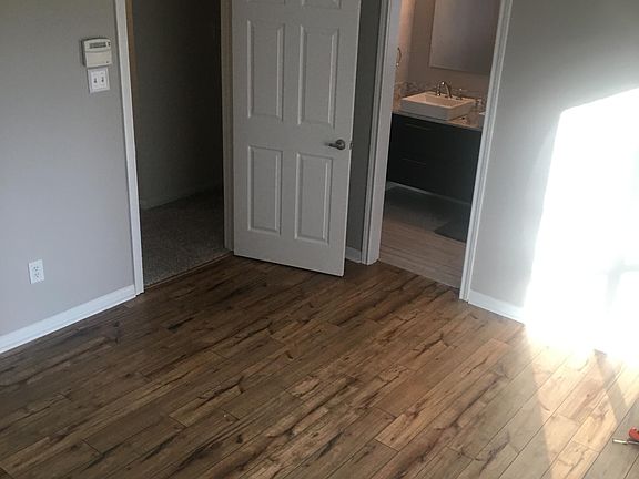 Master bedroom, looking through to master ensuite bathroom.