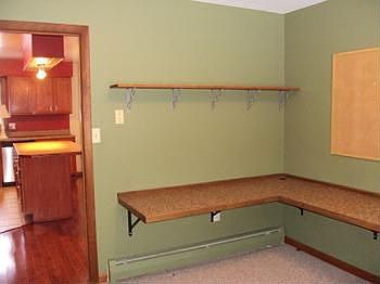 This room is located off the kitchen. It was being used as an office but it could be the 4th bedroom