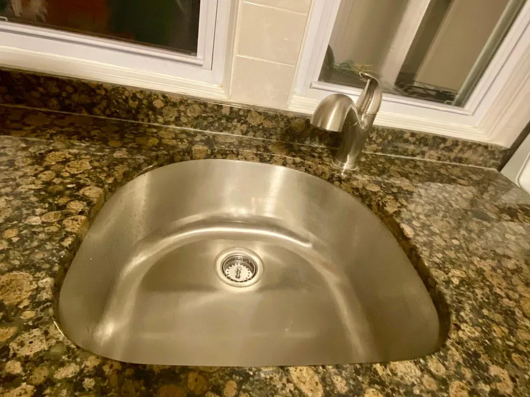 large D-shaped kitchen cabinets, granite, new faucet