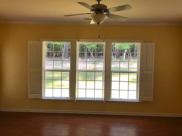 Sunroom with a peaceful, wooded view
