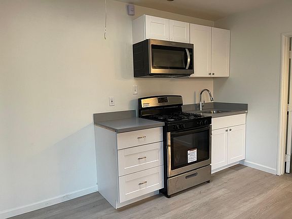 Newly remodeled kitchen with space for a full size refrigerator.