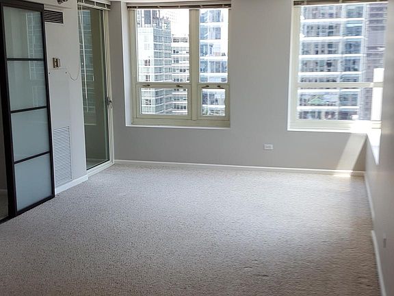 Large Living Space! GRAY TONE WALLS- NEW WOOD FLOORING will be Installed prior to new Tenant moving in-