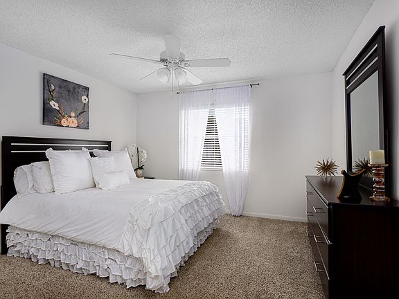 Bedroom with bed and dresser displayed.