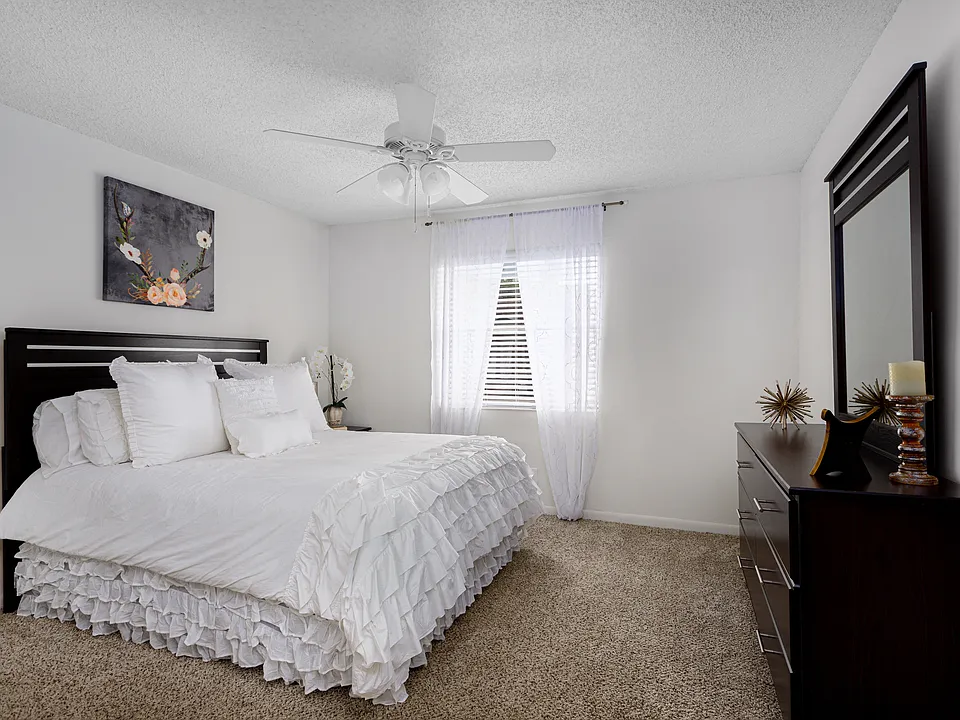 Bedroom with bed and dresser displayed.