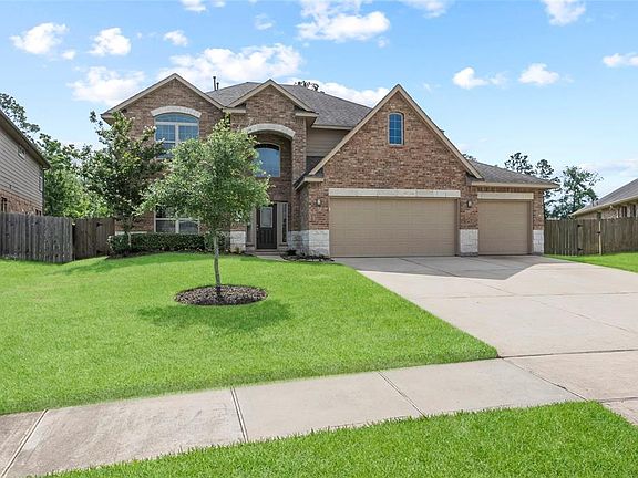 Three car garage with wide driveway makes parking convenient. Sidewalks throughout the community are great for strolling through the neighborhood.