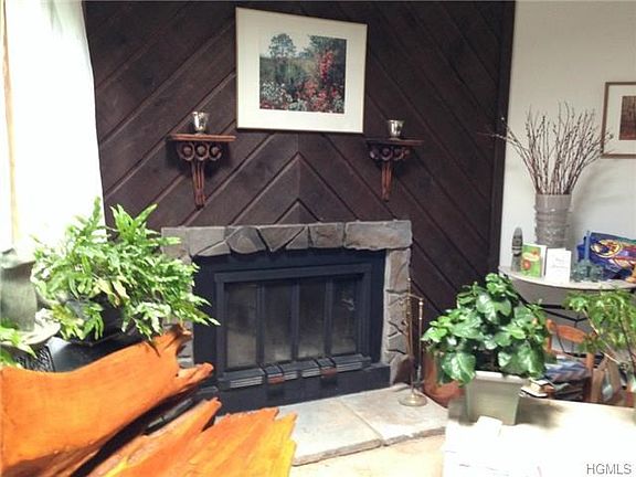 Wood fireplace in large living room