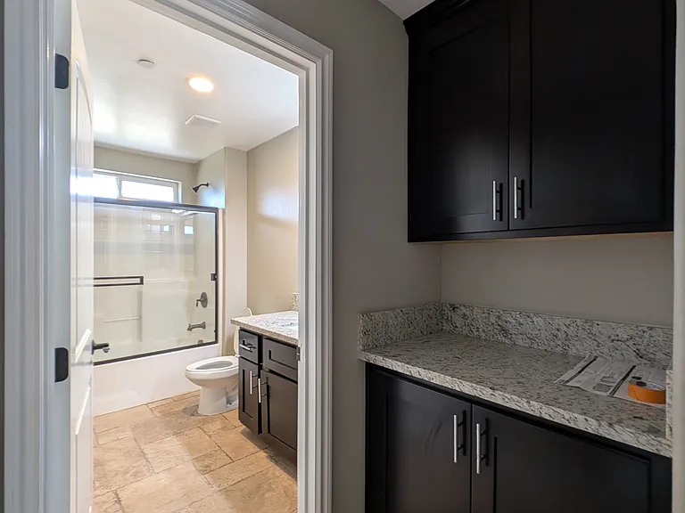 Hallway storage and bathroom entrance