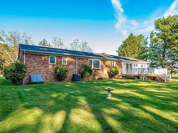 Back of home with deck