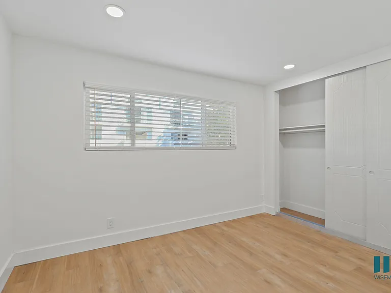 Bedroom with Closet, Recessed Lighting, Vinyl Flooring, and Windows