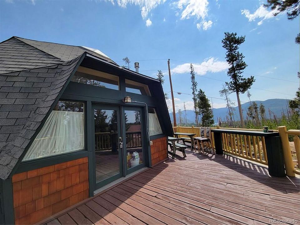 Front entrance with large south facing windows. Wraparound deck with space for grilling and outdoor eating.