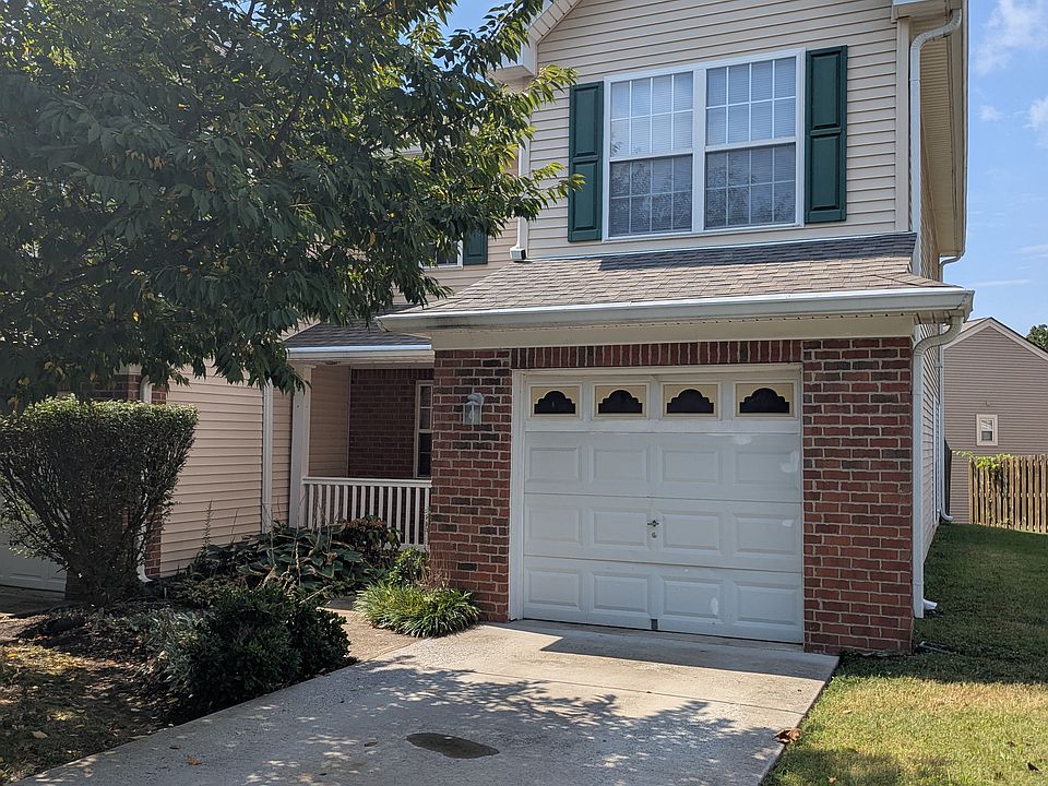 Main entrance, driveway, garage