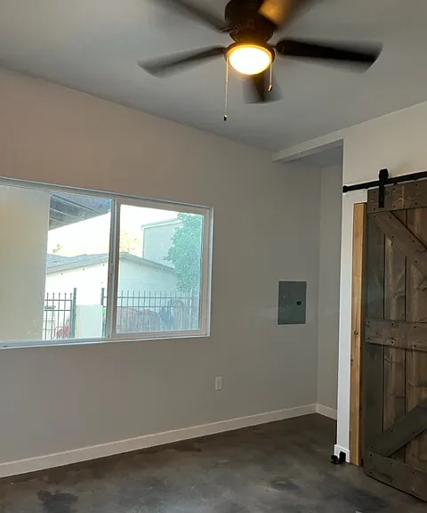 middle bedroom. There are fand in each bedroom, room and porch