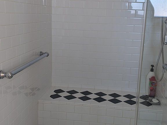 Large shower w/c accessible, no threshold.