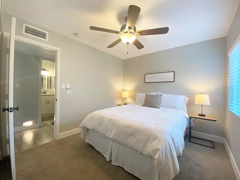 Main Floor Bedroom with Queen bed just across the hall from main floor full bath