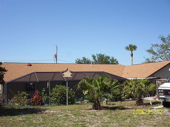 Rear view of home/pool area