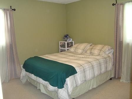 Master bedroom has an attached half bath.