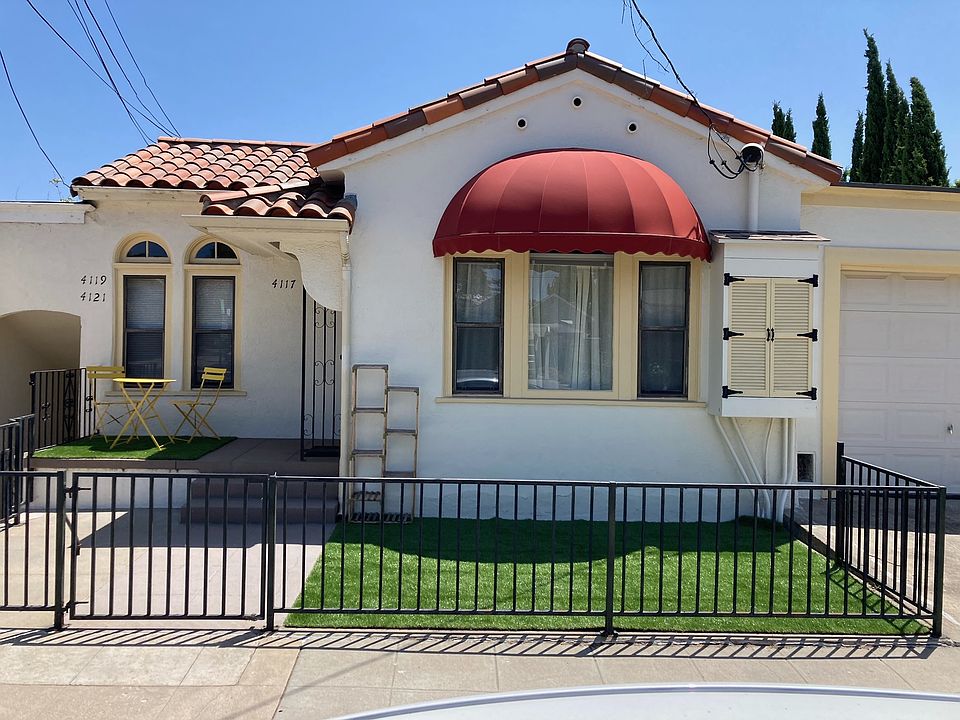 Front of the upstairs unit from the street. The unit for rent is down a few stairs on the left.