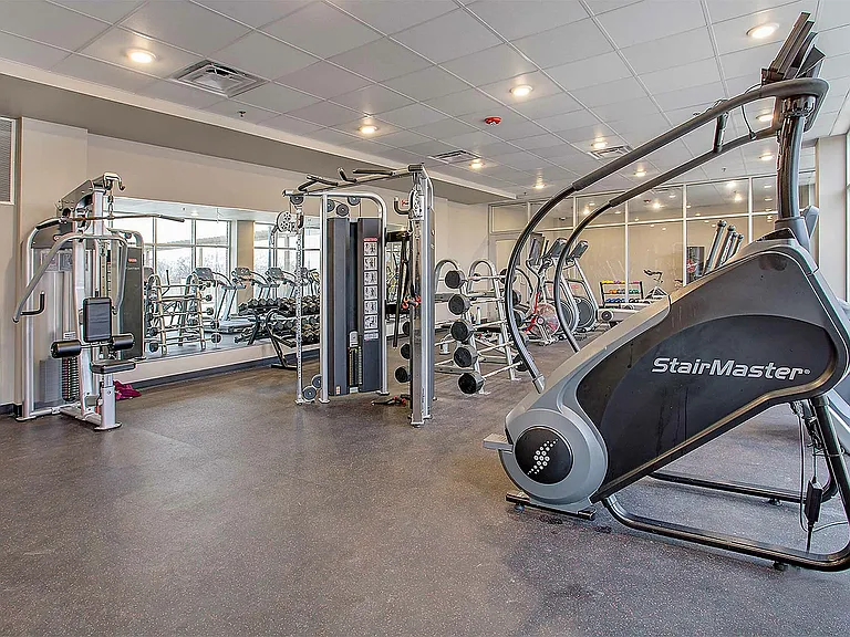 Enjoy top-notch fitness amenities in this luxurious apartment gym.
