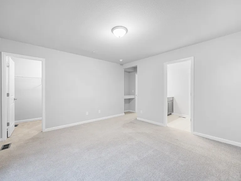 Spacious Primary Bedroom w/walk-in closet and en-suite bath