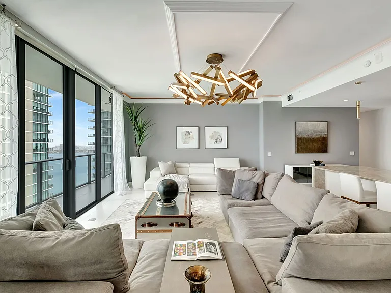Living Room / Enjoy Unobstructed water views and access to the Balcony from every room.
