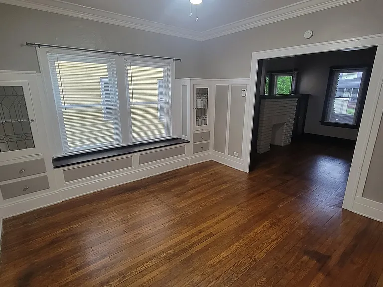 Dining Room with built-in cabinets, hardwood floors, ceiling fan
