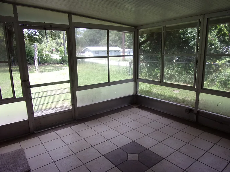 BACK PORCH - TILED FLOOR - ENCLOSED - LAUNDRY HOOK-UPS