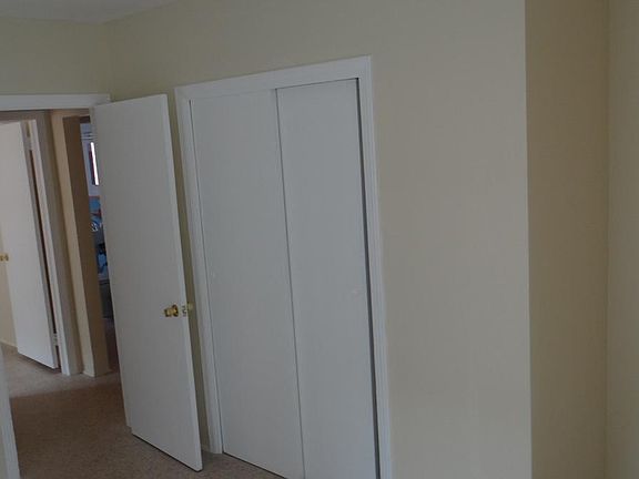 Inside a bedroom with view of the second one