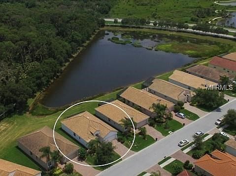 Expansive view of the lake and greenbelt creates a private sitting for this beautiful home.