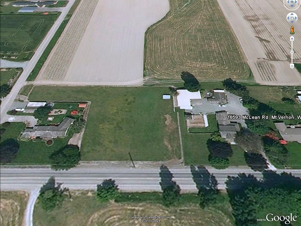 Parcel on left with house/bldgs on right.