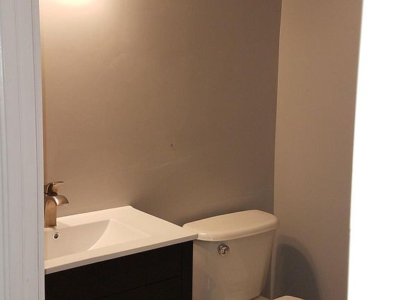 Downstairs half bath with new vanity and lighting
