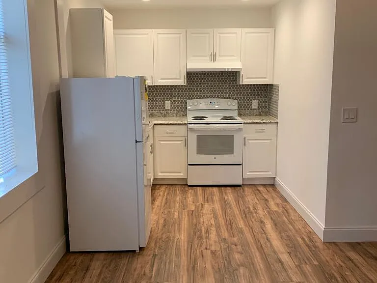 Comfortable, well-lit kitchen with a fridge and essential amenities. Lakeland, FL