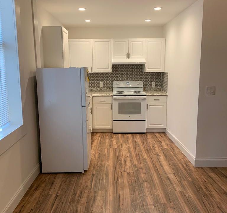 Comfortable, well-lit kitchen with a fridge and essential amenities. Lakeland, FL