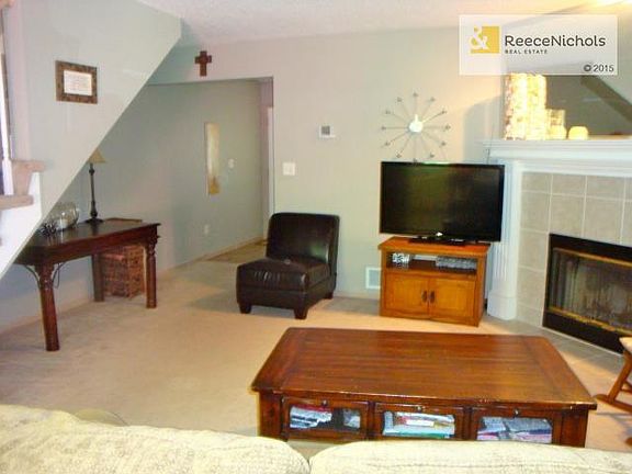 Living Room with wood burning fireplace.