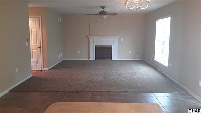 Huge family room with gas fireplace open to kitchen and rear patio/yard