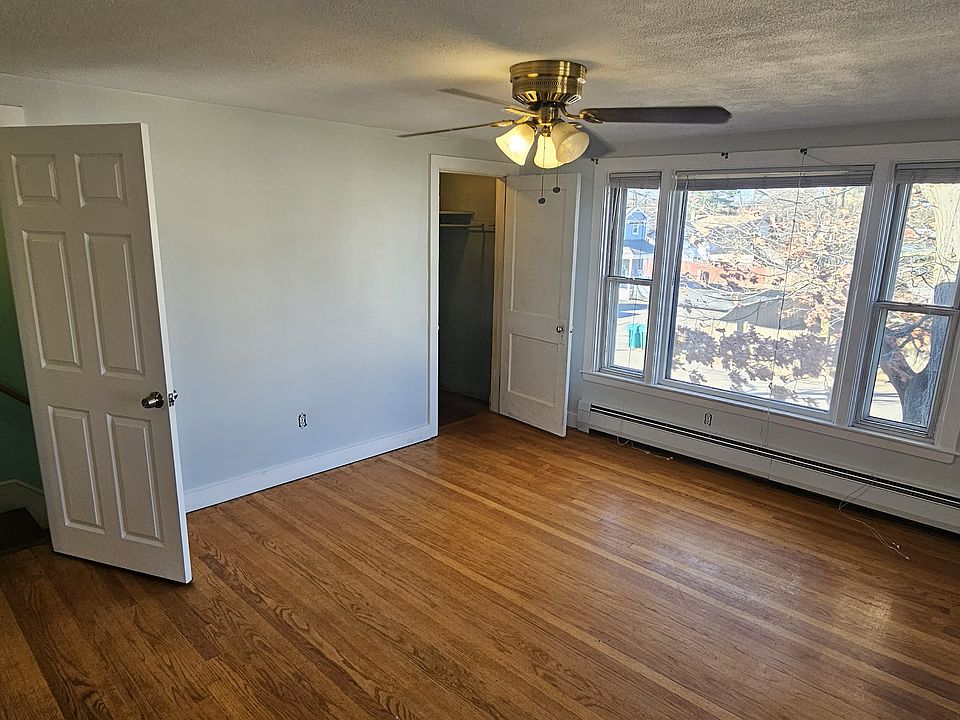 living room view of front entrance & closet