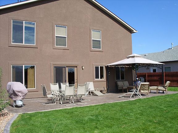 Outdoor Living Area with attached Canopy, Sprinklers, Stamped Concrete, Shed